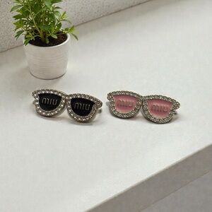 Miu Miu UPCYCLE brooch made with zipper pulls Black available